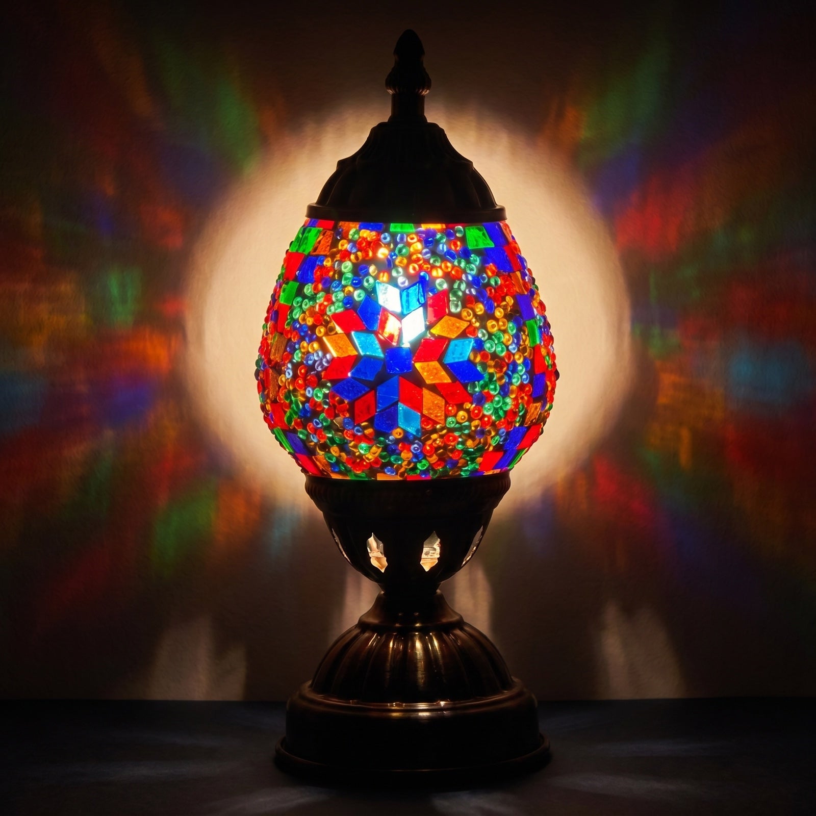 Turkish Lamp with Fiery Mosaic Glasses mosaic glass table lamp — glowing against a deep charcoal background