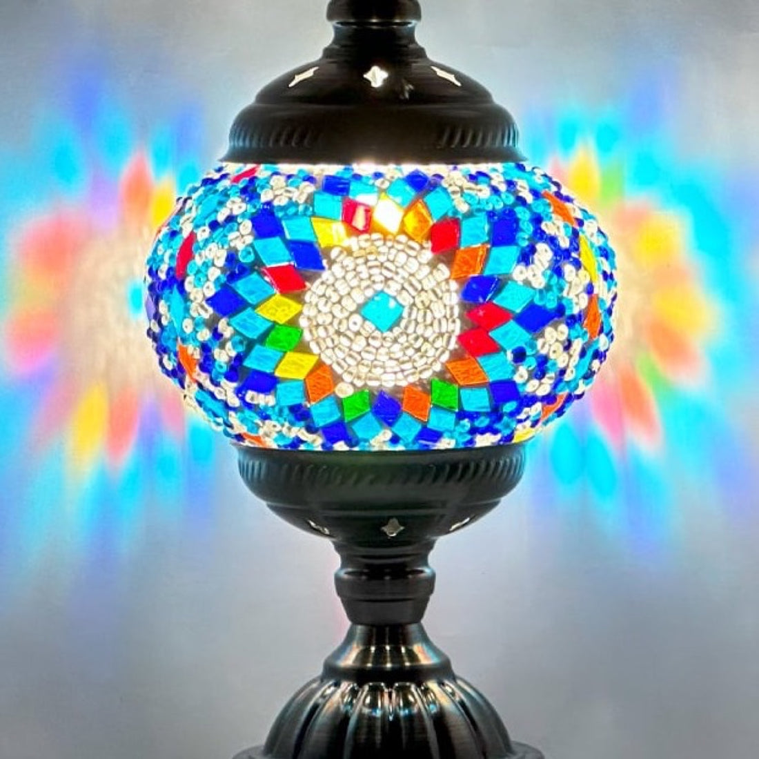 Turkish Mosaic Lamp with Blue Sunflower pattern mosaic glass table lamp — glowing in a warm, dimly-lit evening room