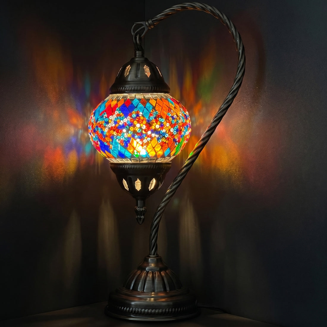 Twin Rainbow Bridge Mosaic Table Lamp with Swan Neck mosaic glass table lamp — glowing against a deep charcoal background
