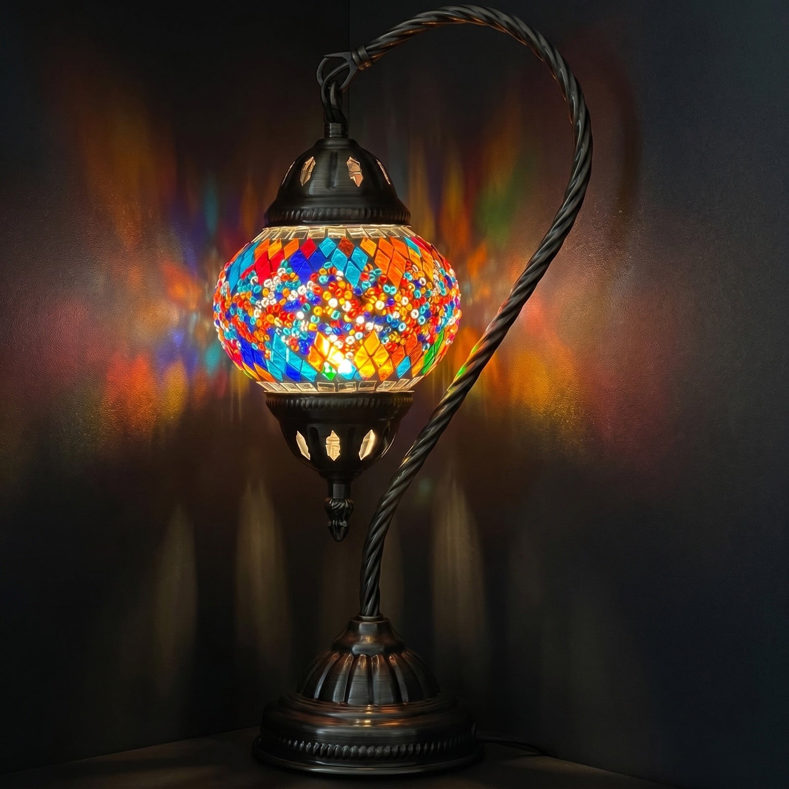 Twin Rainbow Bridge Mosaic Table Lamp with Swan Neck mosaic glass table lamp — glowing against a deep charcoal background