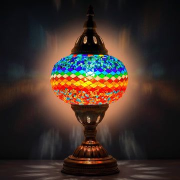 Wave of Colors mosaic glass table lamp — glowing against a deep charcoal background