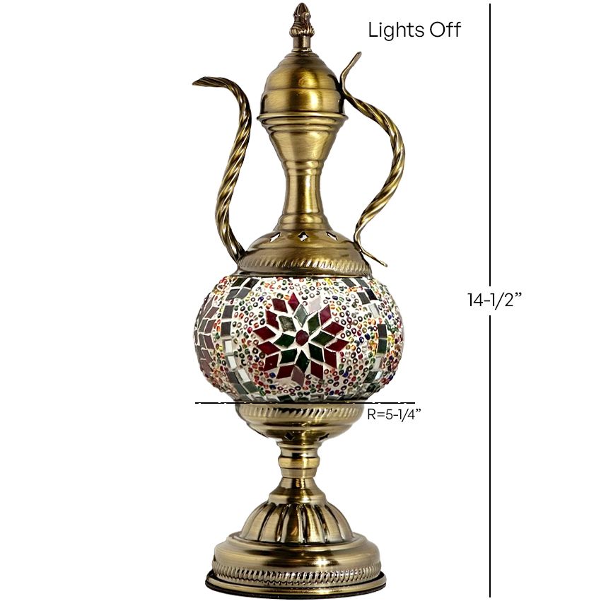 a golden vase with a floral design on it