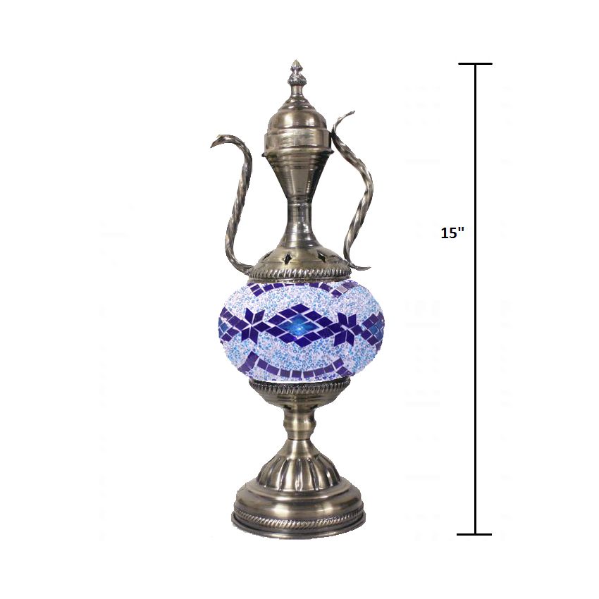 a silver vase with a blue and white design on it