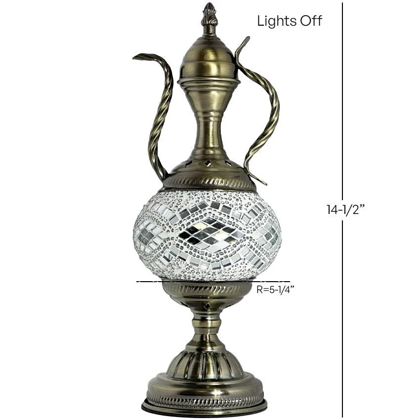 a brass vase with a glass ball on top of it