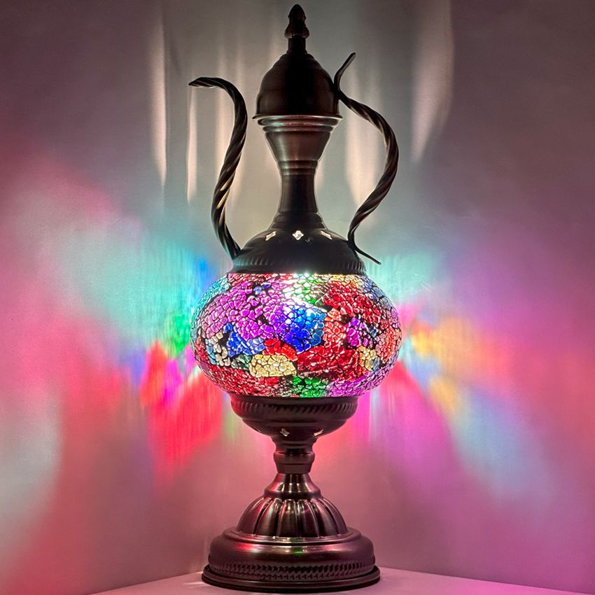 a colorful vase sitting on top of a table