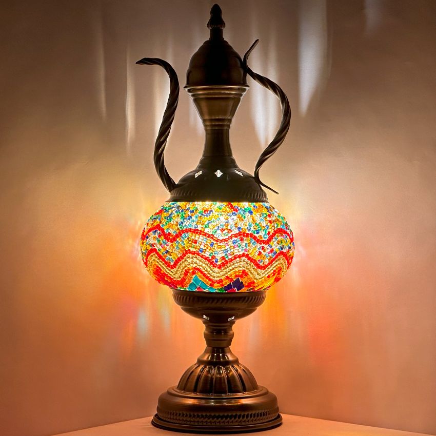 a colorful vase sitting on top of a table