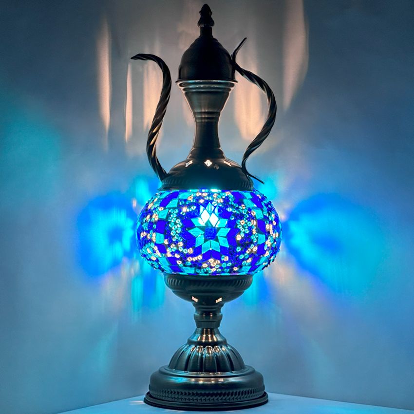 a blue vase with a blue flowered design on it