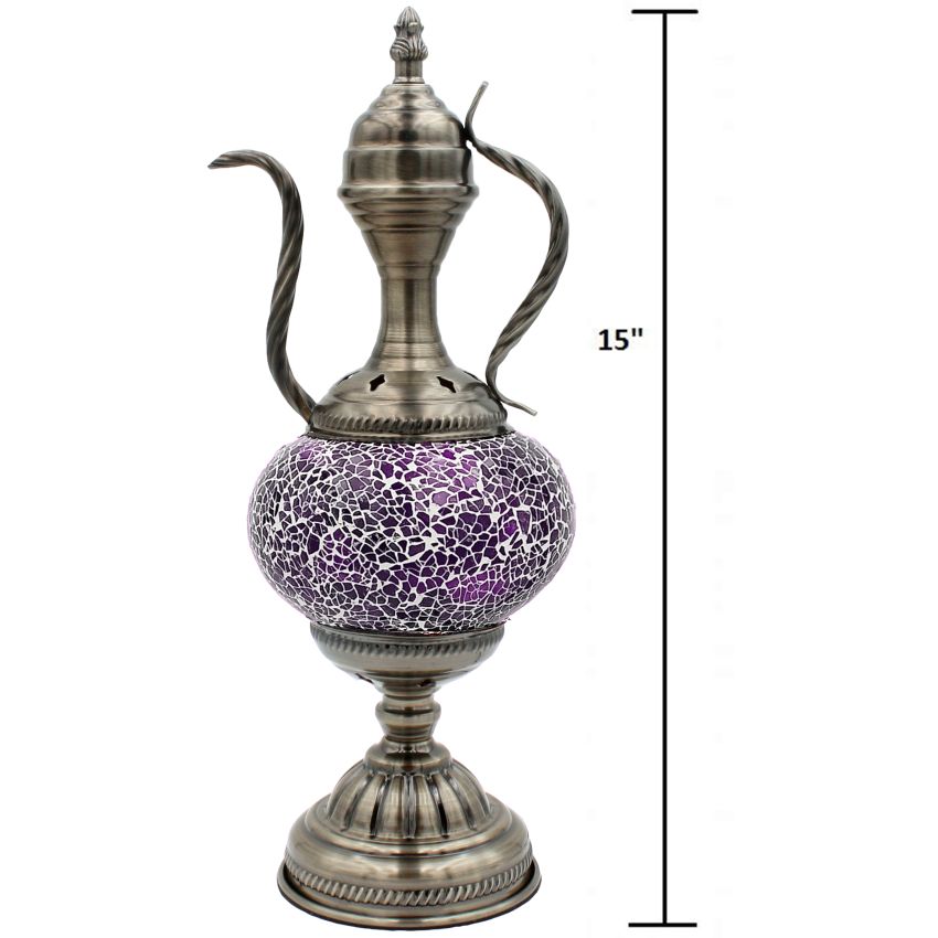 a silver vase with a purple design on it