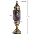a gold colored lamp with a colorful glass shade