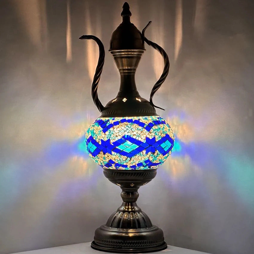 a blue and white vase sitting on top of a table