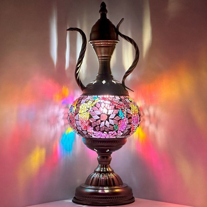 a colorful vase sitting on top of a table