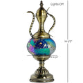 a brass vase with a blue and green design on it