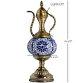 a brass vase with a blue and white mosaic design