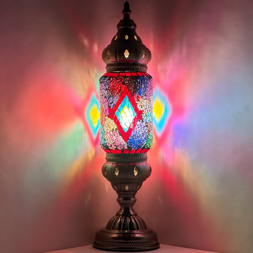a colorful lamp sitting on top of a table