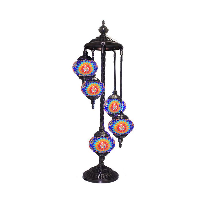 a multicolored lamp on a black stand