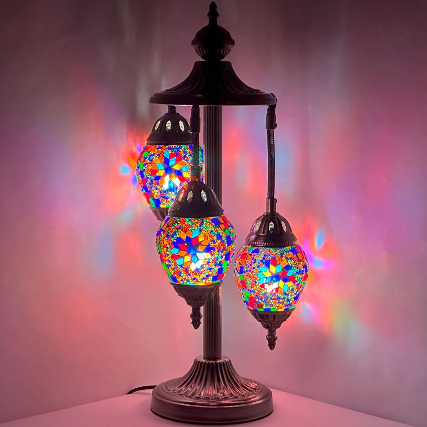 a multicolored lamp with three lights on it