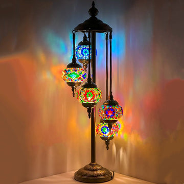 a multicolored lamp is on a table