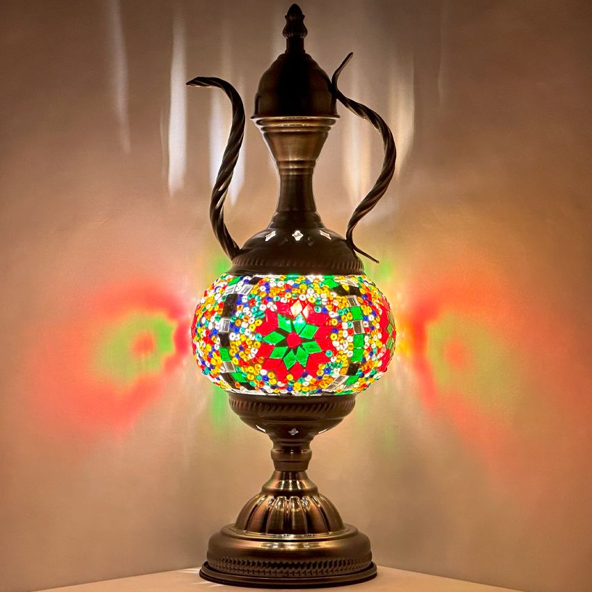 a colorful lamp is sitting on a table