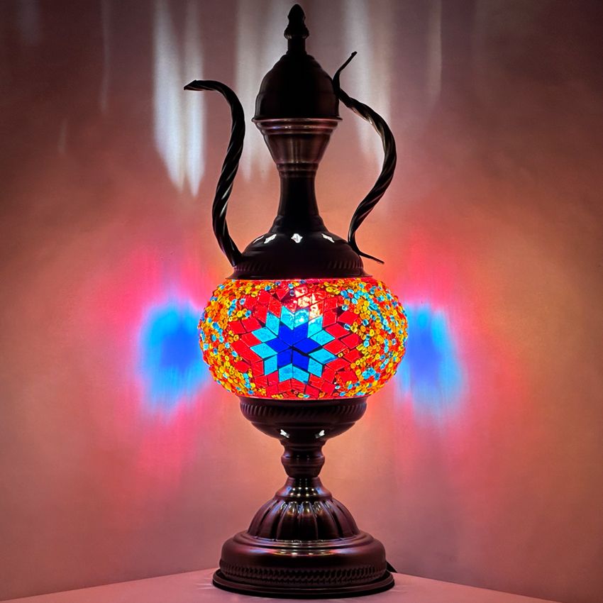 a colorful vase sitting on top of a table
