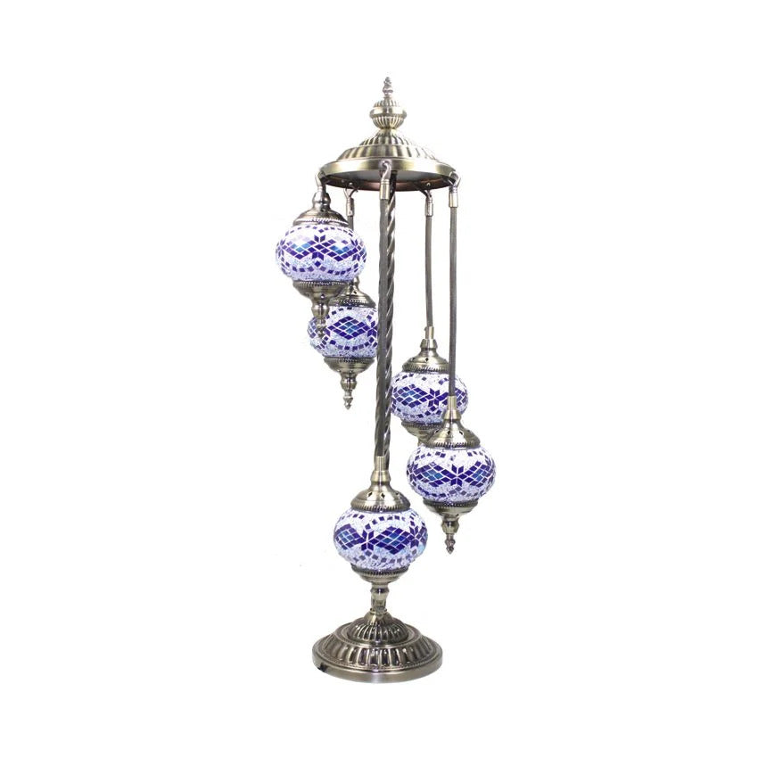 a metal pole with blue and white ornaments on it