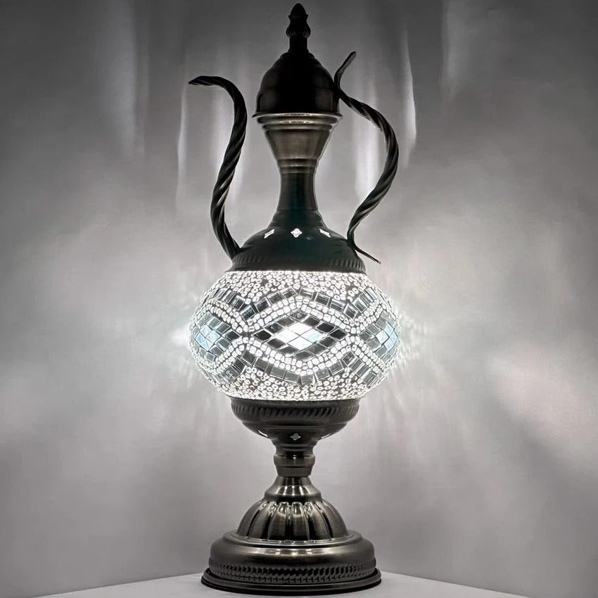 a black vase with a light inside of it