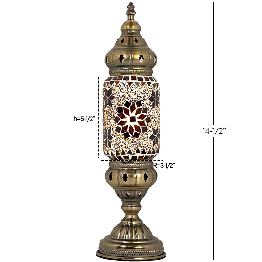 a golden lamp with a flower design on it