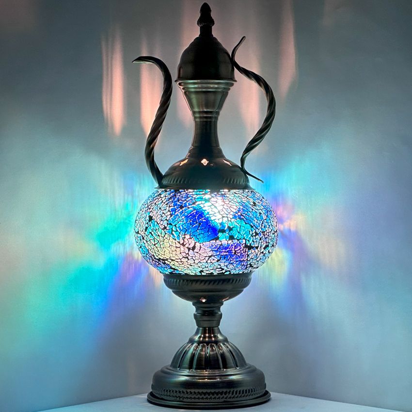 a glass vase with a blue and white design on it